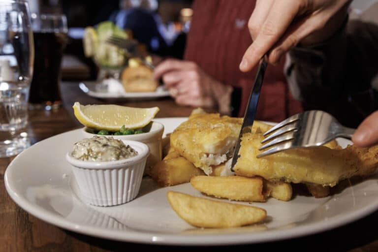 A Customer Enjoying Fish and Chips at The Peacock Country Inn on Sunday